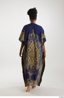 Dina Moses  1 back view dressed traditional decora long…